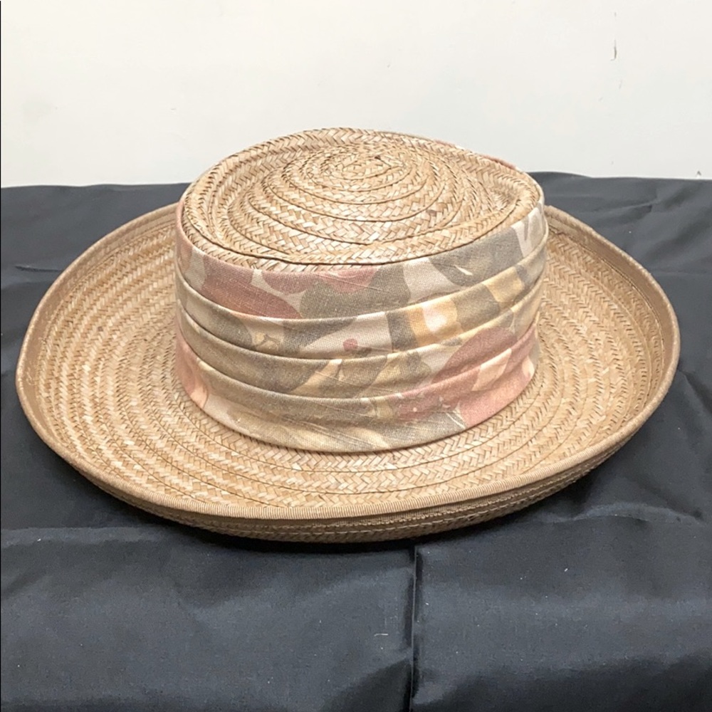 Straw hat with muted-toned ribbon